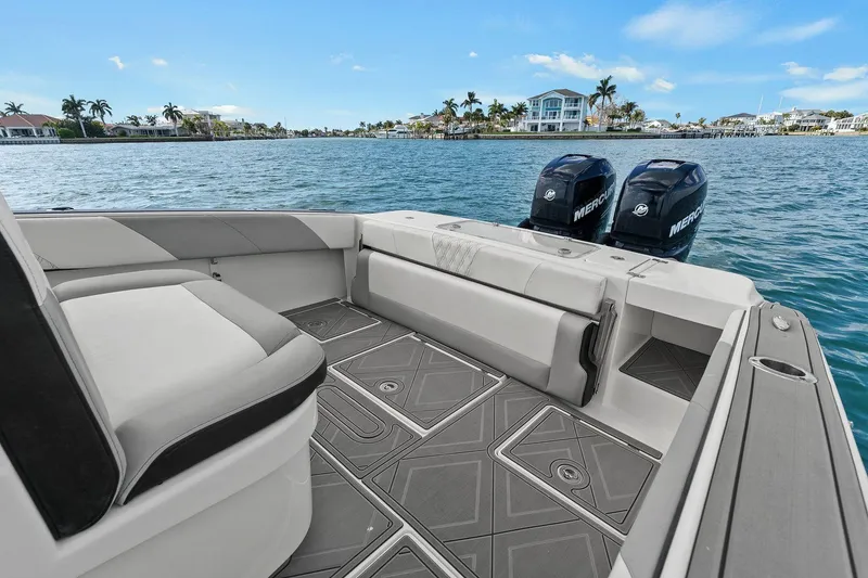 Slide: The Image of Statement 350 Open 2012 boat with twin engines on calm water. - 21