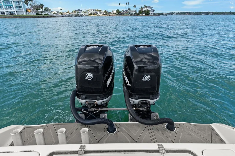 Slide: The Image of Statement 350 Open 2012 with twin Mercury outboard motors on the water. - 22