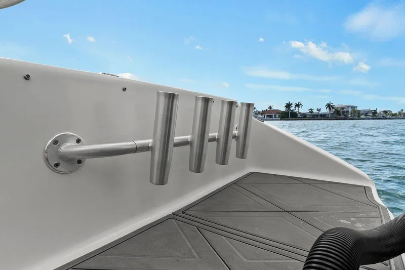 Slide: The Image of Statement 350 Open 2012 boat with fishing rod holders on calm water. - 23