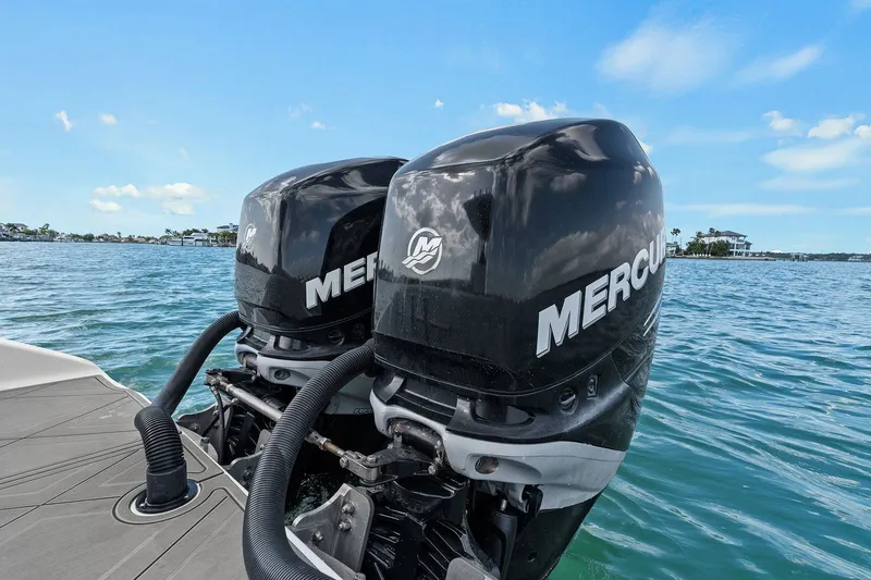 Slide: The Image of Dual Mercury outboard engines on a 2012 Statement 350 Open boat. - 24