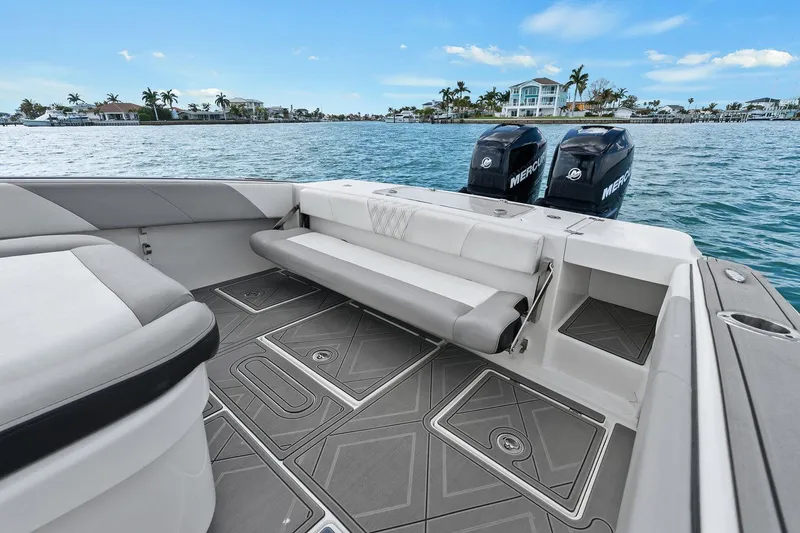 Slide: The Image of Interior of a 2012 Statement 350 Open boat with dual outboard engines. - 26