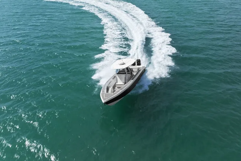 Slide: The Image of Statement 350 Open 2012 boat cruising on open sea. - 4