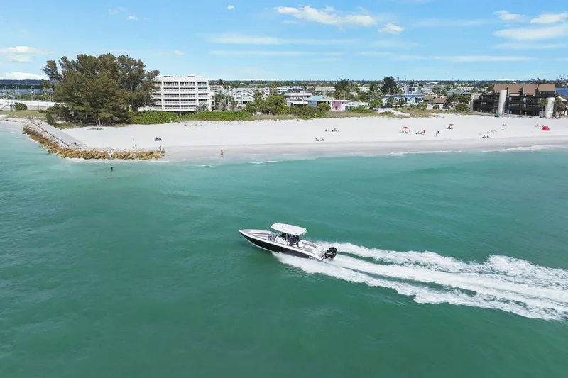 Slide: The Image of Statement 350 Open 2012 motorboat near sandy beach and buildings. - 5