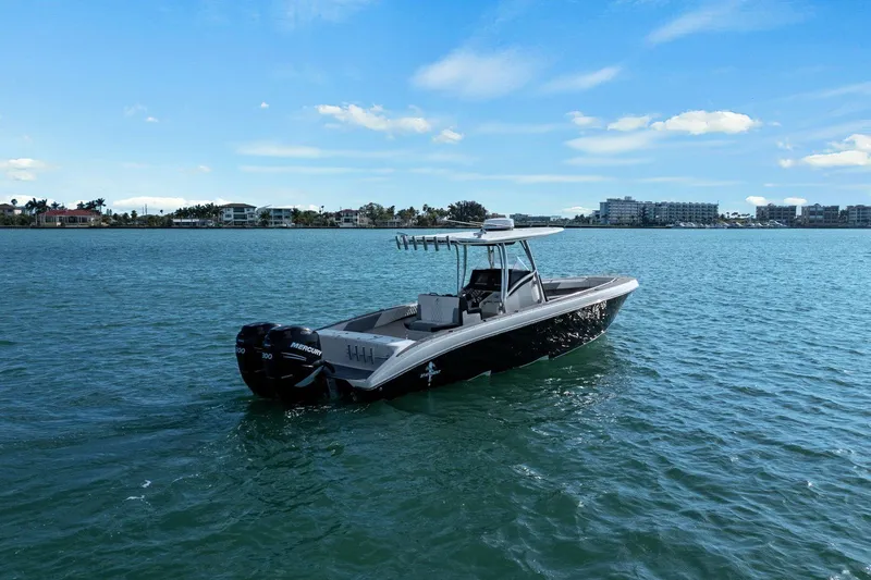 Slide: The Image of 2012 Statement 350 Open boat on calm water. - 6