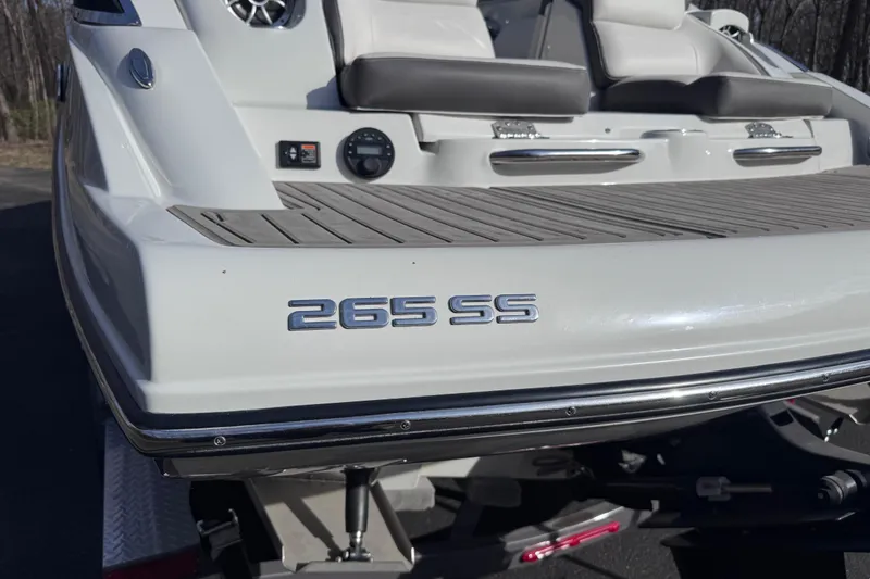 Slide: The Image of 2022 Crownline 265 SS boat rear view with seating and model emblem. - 10