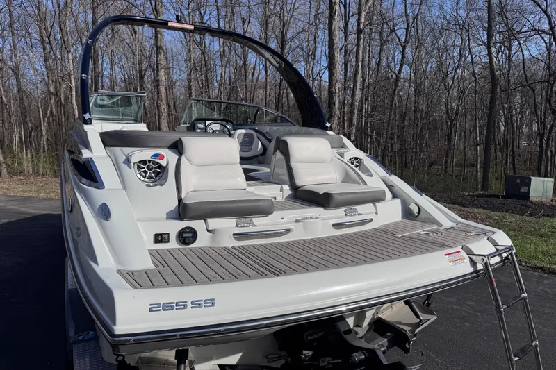 Slide: The Image of 2022 Crownline 265 SS boat with sleek design, spacious seating, and modern features. - 11