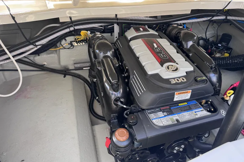 Slide: The Image of Engine compartment of a 2022 Crownline 265 SS boat featuring a Mercury 6.2L engine. - 15