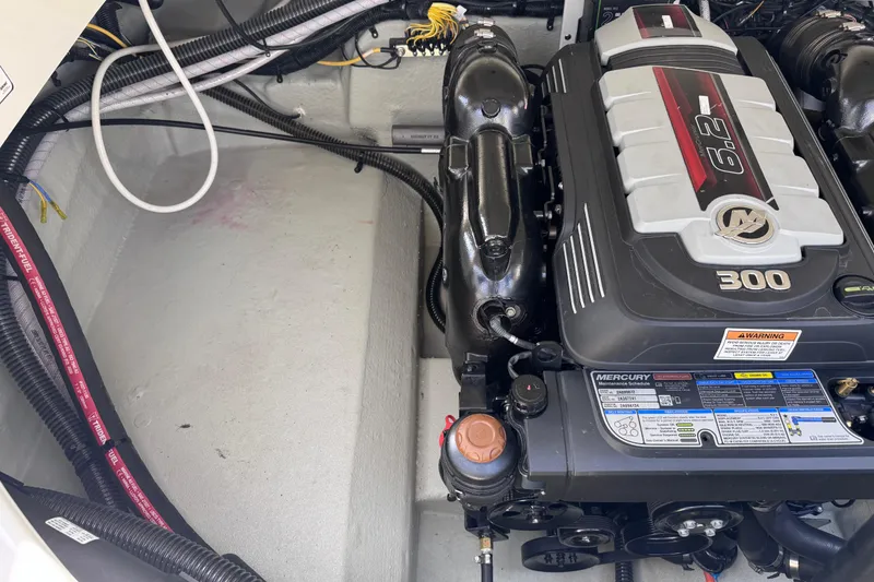 Slide: The Image of Engine compartment of a 2022 Crownline 265 SS boat with Mercury 6.2L engine. - 16