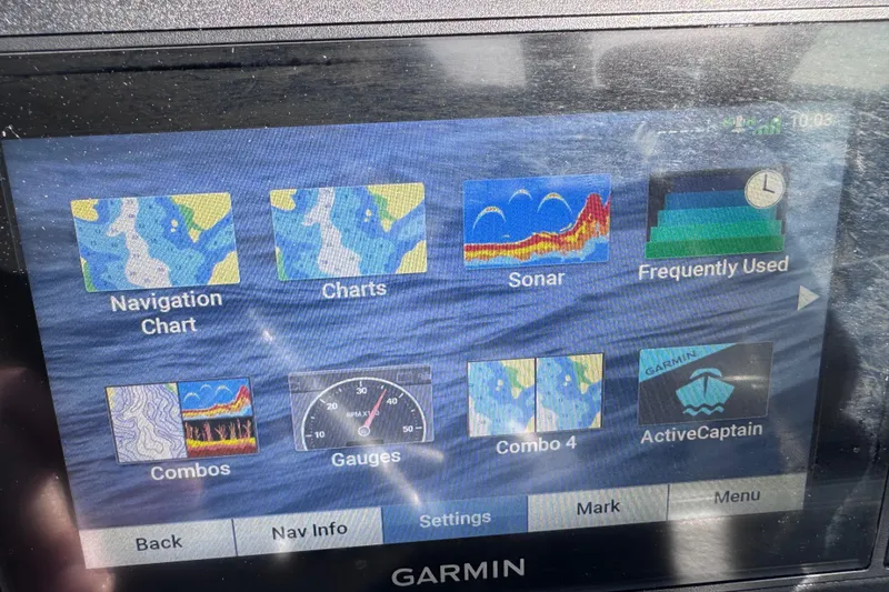 Slide: The Image of Garmin marine display showing navigation, charts, sonar, and gauges on a 2022 Crownline 265 SS. - 19