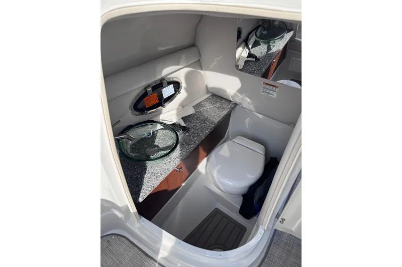 Slide: The Image of 2022 Crownline 265 SS boat interior with modern bathroom amenities. - 22