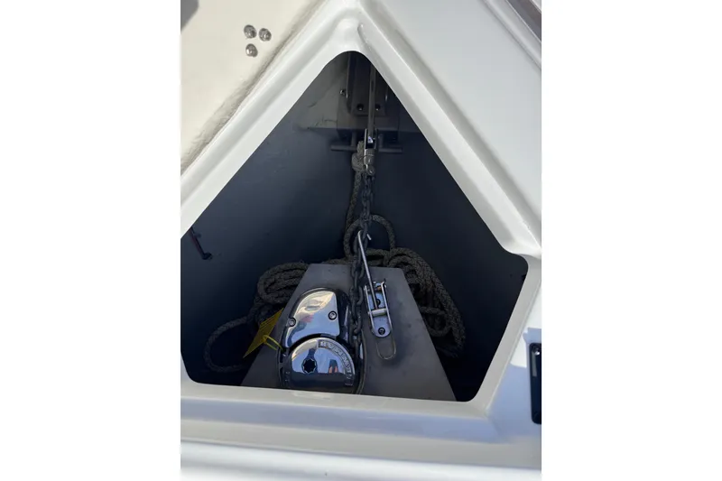 Slide: The Image of Anchor compartment of 2022 Crownline 265 SS boat with rope and chain. - 28