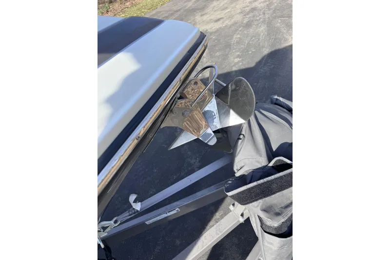 Slide: The Image of 2022 Crownline 265 SS boat propeller and stern detail in sunlight. - 29