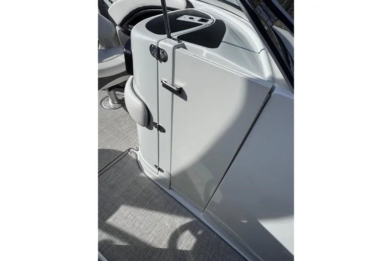 Slide: The Image of 2022 Crownline 265 SS boat interior with seating and storage compartment. - 35
