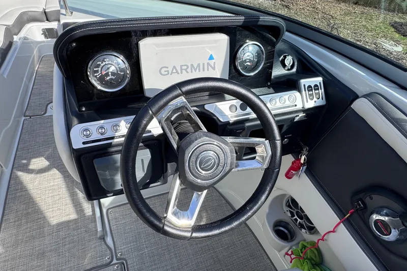 Slide: The Image of Steering wheel and dashboard of 2022 Crownline 265 SS boat with Garmin display. - 39