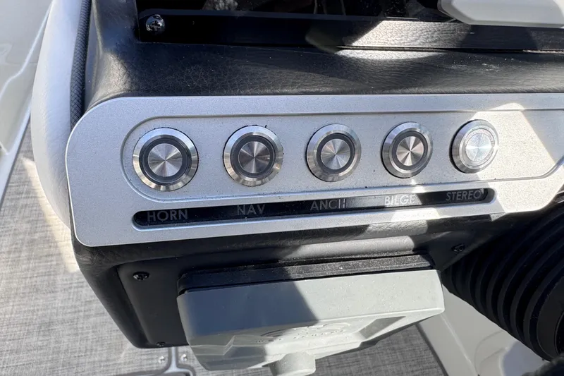 Slide: The Image of Control panel of 2022 Crownline 265 SS boat with labeled buttons: horn, nav, anchor, bilge, stereo. - 40