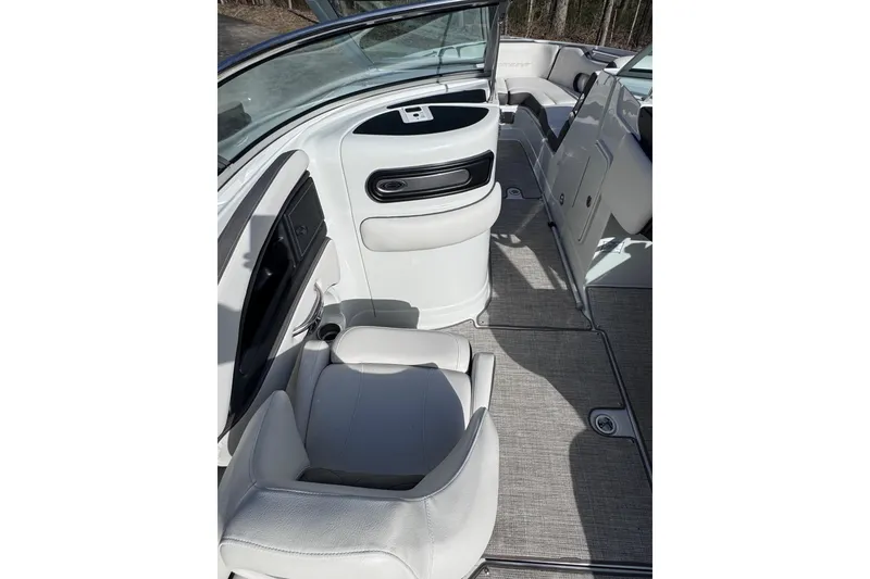 Slide: The Image of 2022 Crownline 265 SS boat interior with white seating and modern design. - 43