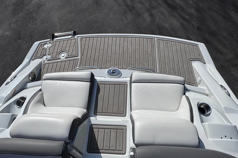 Slide: The Image of 2022 Crownline 265 SS boat deck with cushioned seating and sleek design. - 45