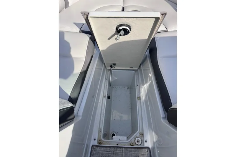 Slide: The Image of Open storage compartment in 2022 Crownline 265 SS boat interior. - 48