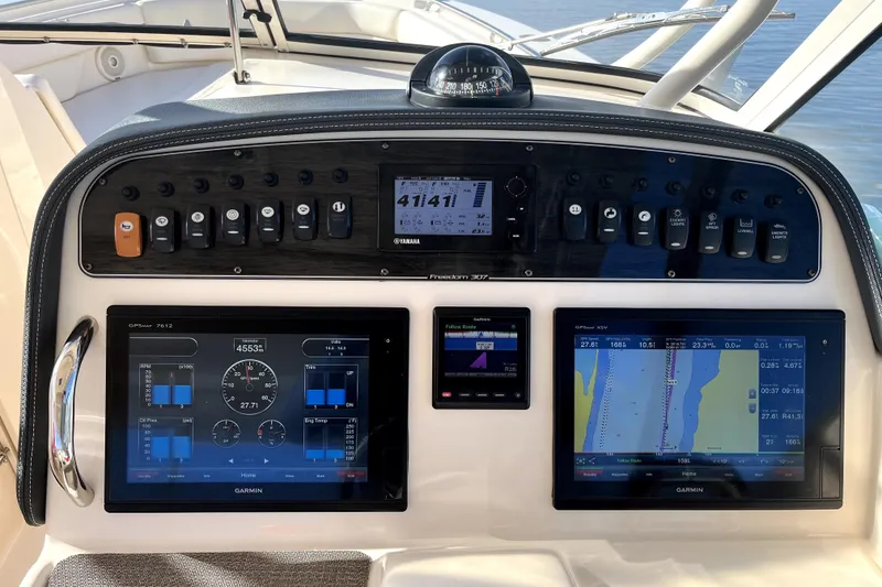 Slide: The Image of Control panel of 2017 Grady-White Freedom 307 boat with Garmin navigation displays. - 7