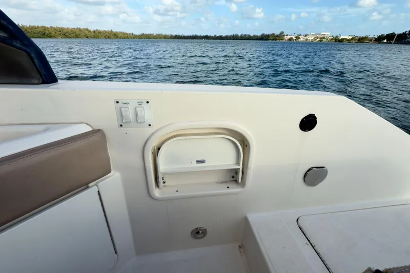 Slide: The Image of 2017 Sea Ray SLX 310 Outboard boat interior with water view and seating area. - 18