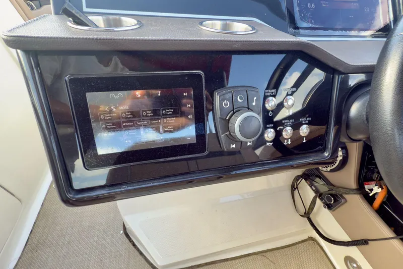 Slide: The Image of Control panel of a 2017 Sea Ray SLX 310 Outboard boat with touchscreen and buttons. - 37