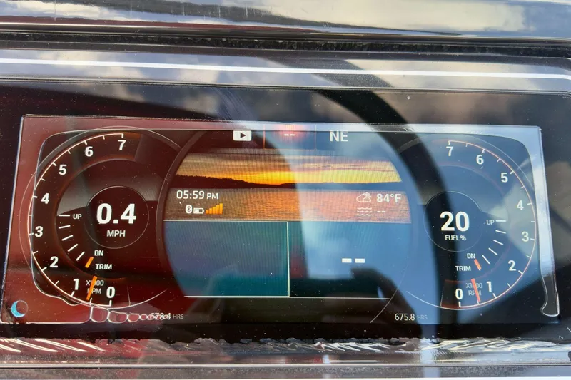 Slide: The Image of Dashboard of a 2017 Sea Ray SLX 310 Outboard showing speed, fuel, and temperature. - 39