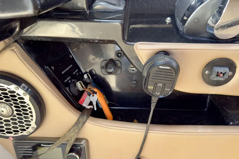 Slide: The Image of Control panel of a 2017 Sea Ray SLX 310 Outboard boat with speaker and microphone. - 40