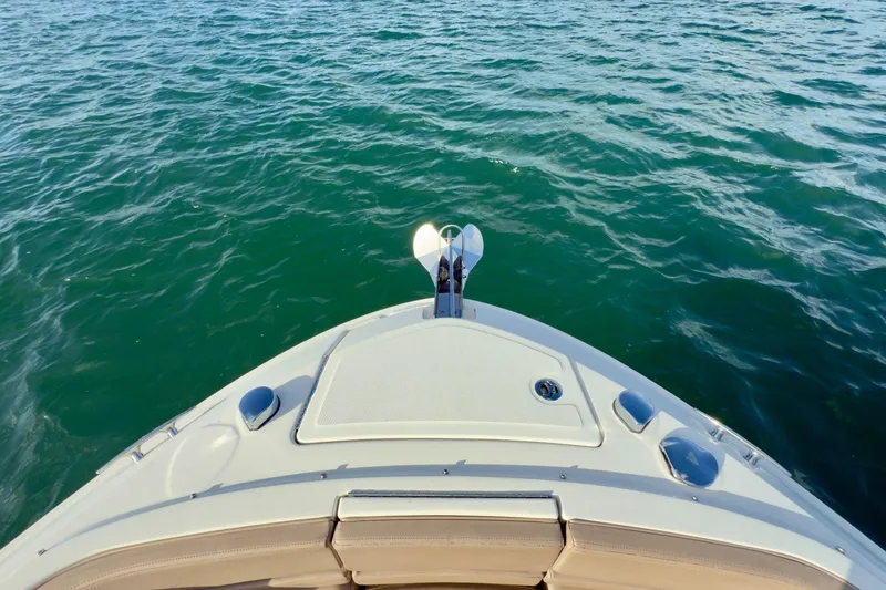 Slide: The Image of Bow view of 2017 Sea Ray SLX 310 Outboard on calm water. - 42