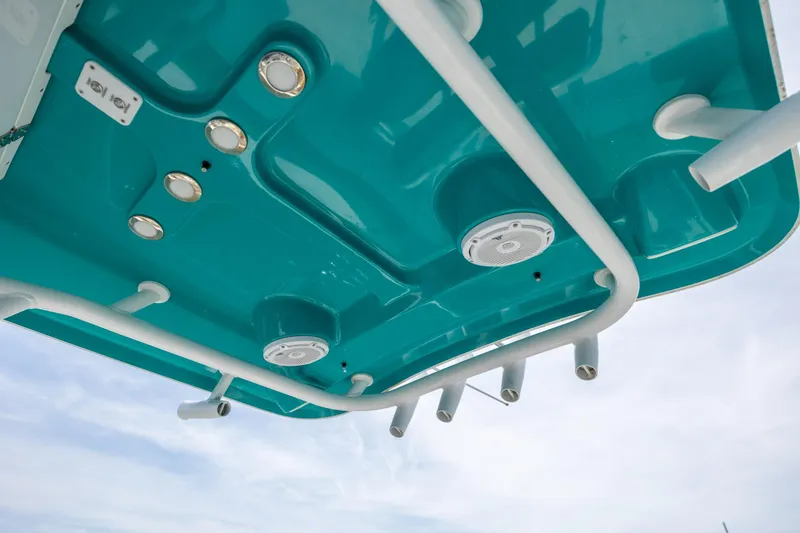 Slide: The Image of Underside view of 2022 Sea Hunt Ultra 234 boat's teal canopy with lights and speakers. - 13