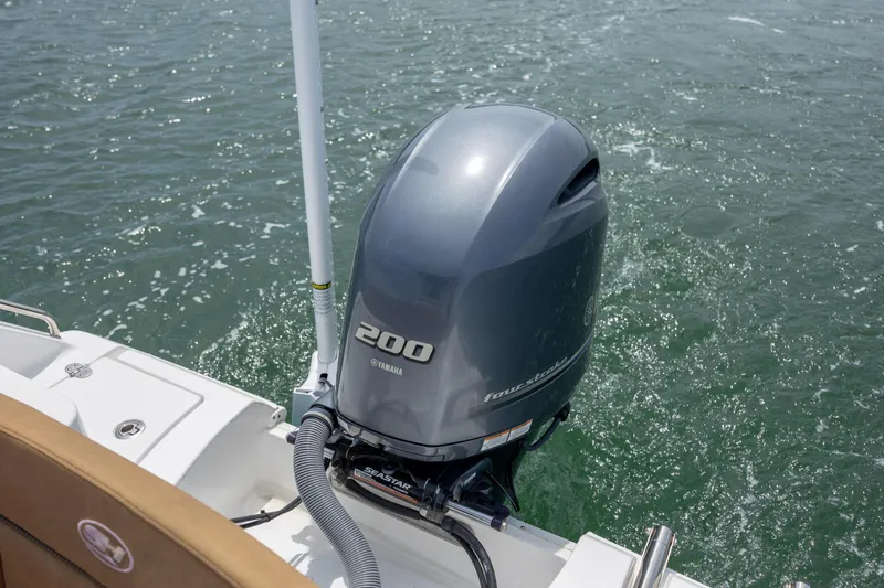 Slide: The Image of Yamaha 200 outboard motor on 2022 Sea Hunt Ultra 234 boat in water. - 7