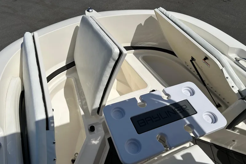 Slide: The Image of 2022 Bayliner Trophy T20CX boat interior with seating and storage compartments. - 14