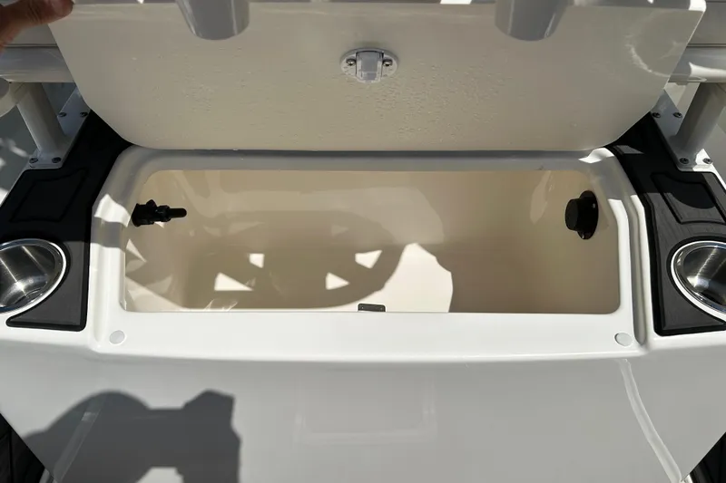 Slide: The Image of Open storage compartment on 2022 Bayliner Trophy T20CX boat, featuring cup holders. - 17