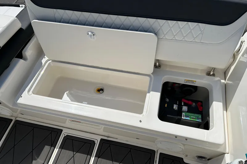 Slide: The Image of 2022 Bayliner Trophy T20CX boat storage compartment and battery area. - 18