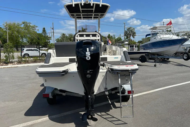 Slide: The Image of 2022 Bayliner Trophy T20CX boat with Mercury 150 engine, parked outdoors. - 3