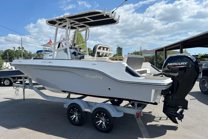 Slide: The Image of 2022 Bayliner Trophy T20CX boat on trailer with Mercury outboard motor. - 4
