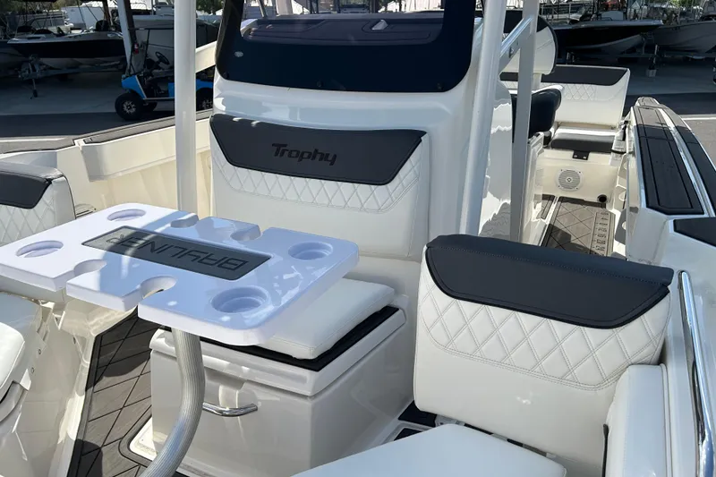 Slide: The Image of 2022 Bayliner Trophy T20CX boat interior with seating and table setup. - 9