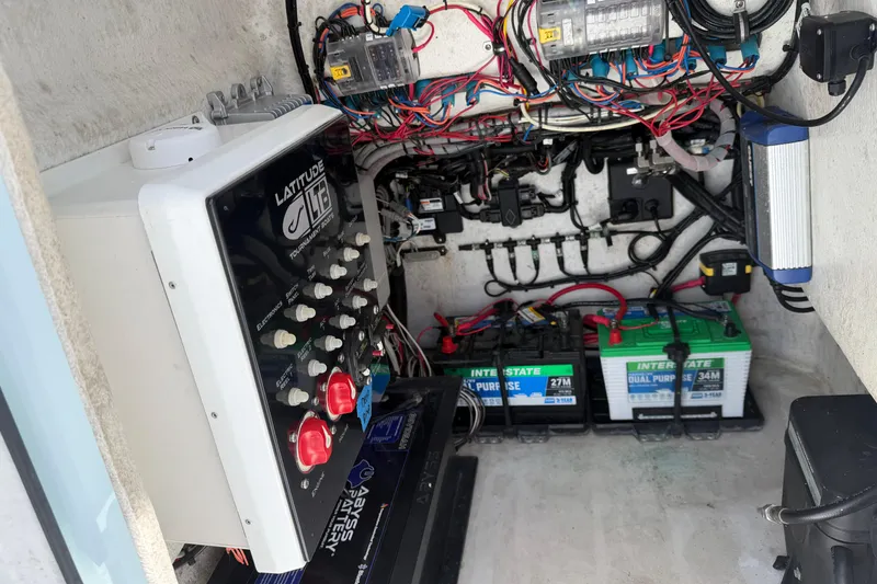 Slide: The Image of Electrical system of 2022 Latitude Tournament Boats 25 with batteries and wiring. - 14