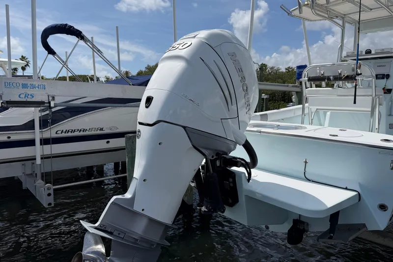 Slide: The Image of 2022 Latitude Tournament Boats 25 with Mercury outboard engine docked at marina. - 3