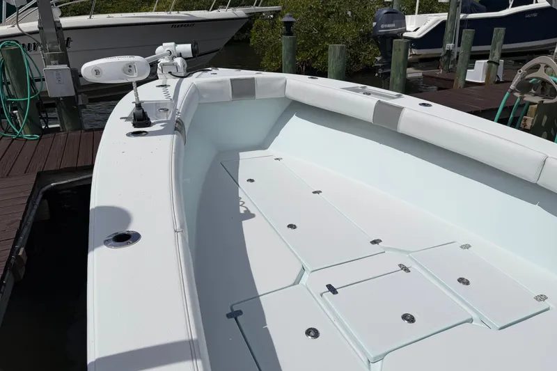 Slide: The Image of 2022 Latitude Tournament Boats 25, spacious deck, docked at marina. - 6