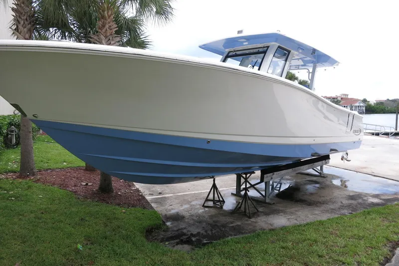 The Image of 2025 Robalo R360 Center Console boat on stands, side view. - 0