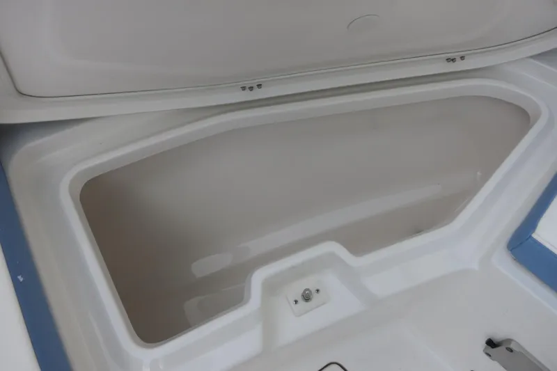 Slide: The Image of 2025 Robalo R360 Center Console storage compartment, showcasing spacious interior design. - 12