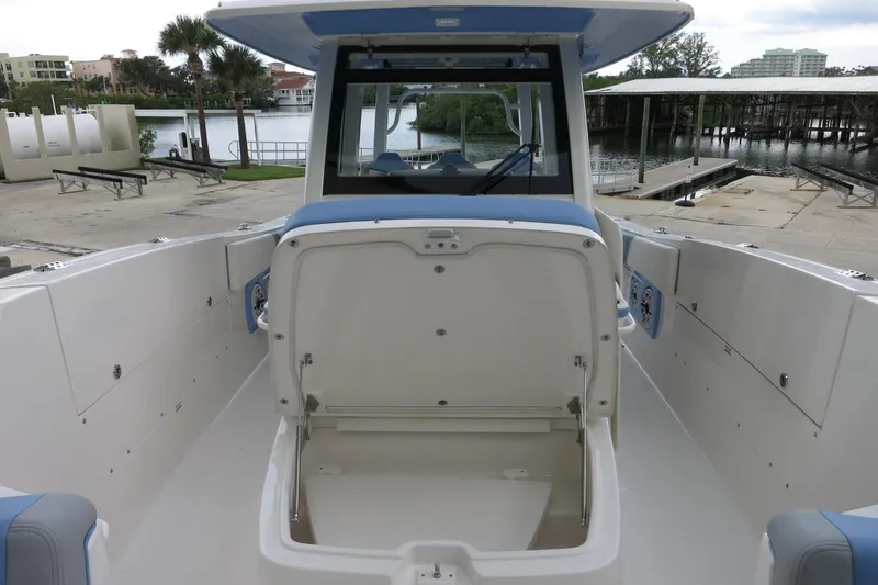 Slide: The Image of 2025 Robalo R360 Center Console boat interior with open storage compartment. - 14