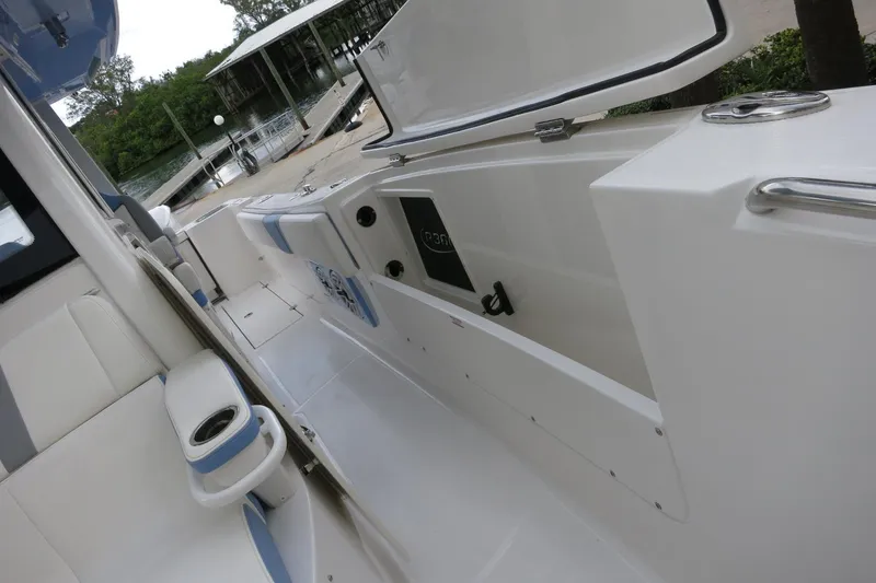 Slide: The Image of 2025 Robalo R360 Center Console boat interior with seating and storage compartments. - 15