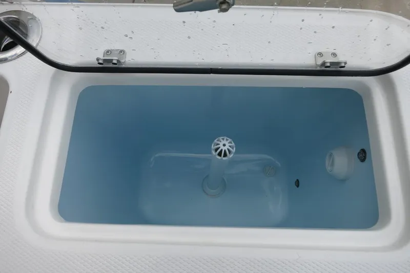Slide: The Image of Livewell tank on 2025 Robalo R360 Center Console boat, filled with water. - 19
