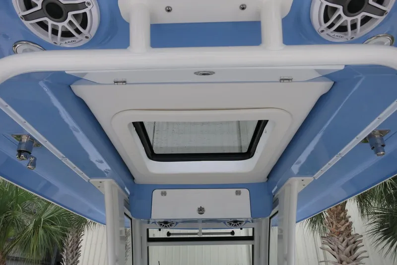 Slide: The Image of 2025 Robalo R360 Center Console boat roof with speakers and hatch. - 20