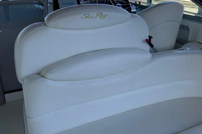 Slide: The Image of White leather seating on a 2000 Sea Ray Sundancer boat interior. - 4