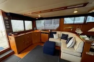 Slide: The Image of Luxurious interior of a 1993 Mikelson 50 Sportfisher yacht with cozy seating. - 14