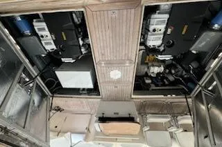 Slide: The Image of Engine room of a 1993 Mikelson 50 Sportfisher yacht, showcasing dual engines. - 16