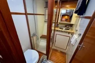 Slide: The Image of Bathroom interior of 1993 Mikelson 50 Sportfisher yacht with shower and sink. - 9