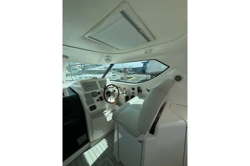 Slide: The Image of Interior helm of 2006 Tiara Yachts 4300 Sovran with modern navigation equipment. - 10